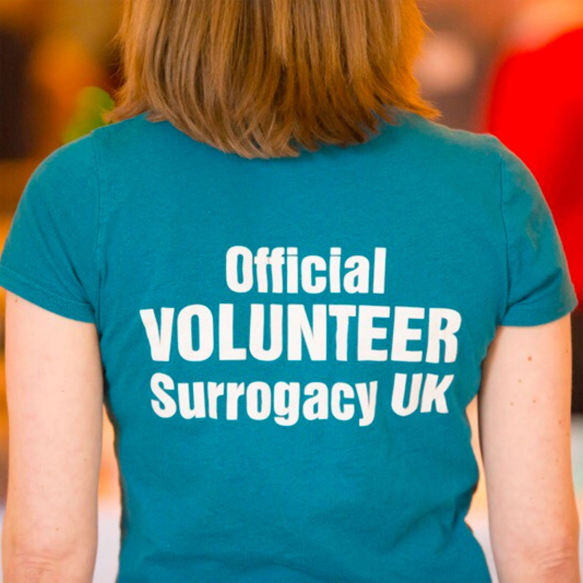 Save the Date - Official Volunteer Surrogacy UK on a blue t shirt